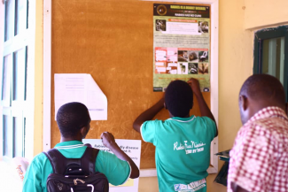 Pasting of poster on school's notice boards by War against Rabies Nigeria Team