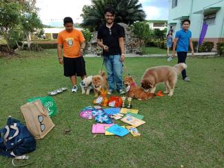 Dog owner of 4 needs assiatance tance carrying his prizes 
