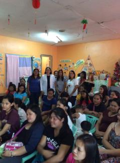 Dra. Rachel Santos gamely post with the mothers after the awareness.