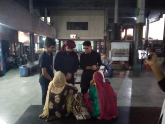 Students distributing pamphlets to passengers awaiting for their bus and giving brief information regarding prevention of rabies after dog bite.