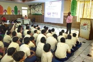 School children of The Aryan School listening carefully about the methods of rabies prevention
