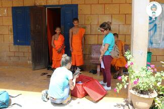 Working with the local monks to give care to abandoned animals 