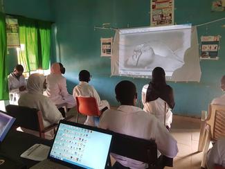 I.T students watching projector clips on rabies