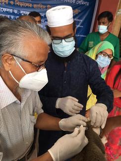 Dean of FVS, Prof. Dr. Md. Mokbul Hossain administers Rabies vaccine
