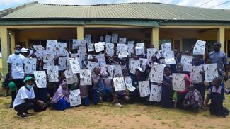 PRIMARY SCHOOL STUDENTS WITH THE RABIES AWARENESS POSTERS AT THE WORLD RABIES DAY 2021 SYMPOSIUM