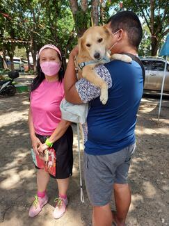 Such a lovely sight. The pet being carried by her fur parents while on her way to full recovery from the general anesthesia