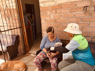 Palesa vaccinating a dog