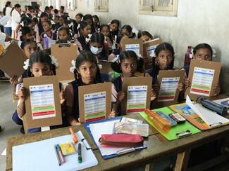 Gifts(pad) with pamphlet stuck for students ( Urban school)