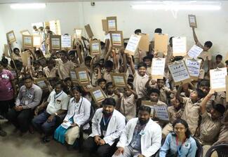 Gifts(pad) with pamphlet stuck for students ( Rural school)