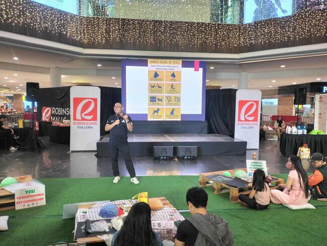 Dr Del Napoles speaking about rabies in a local mall