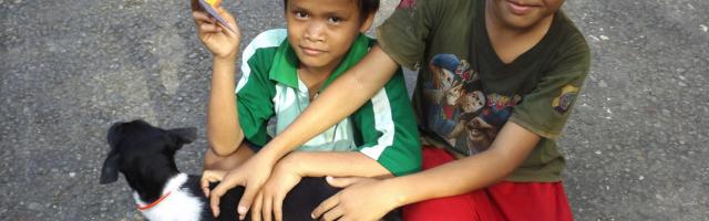 Children showing vaccination record