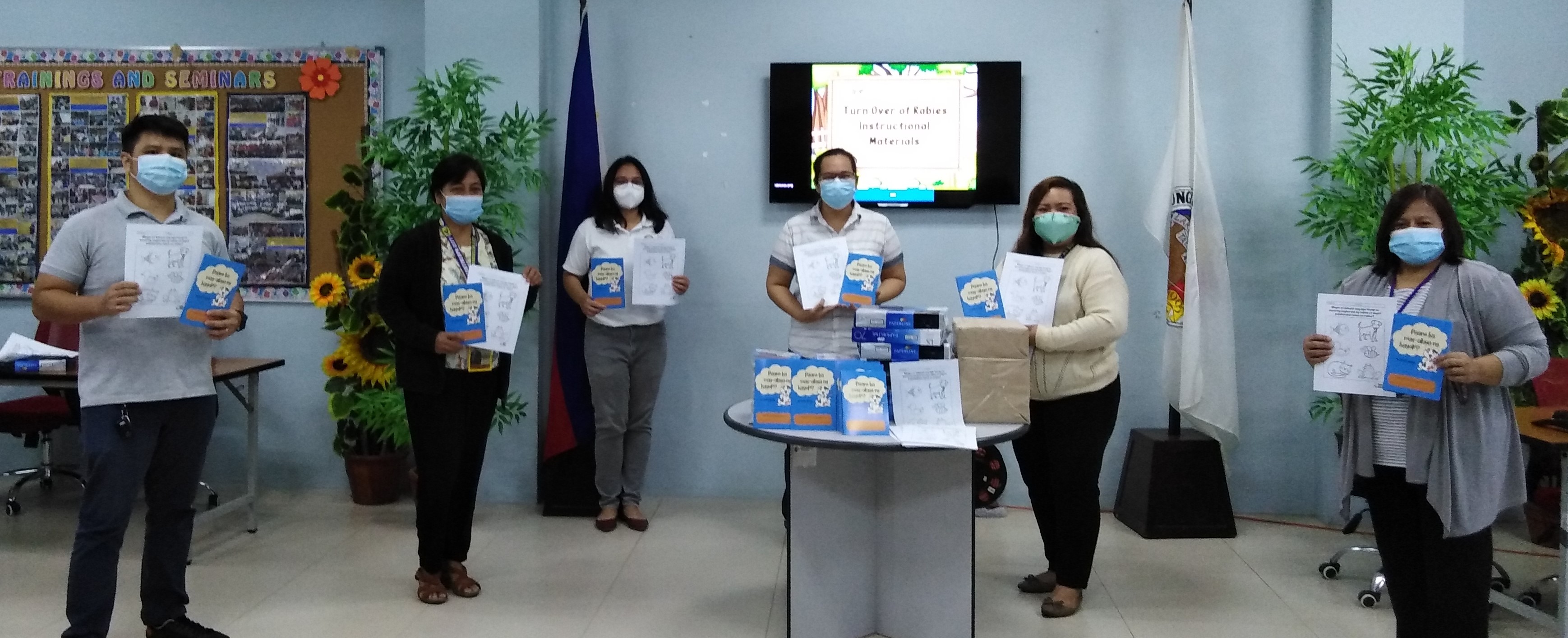 The GARC Philippines team hands over education materials to the ECED in Philippines. 